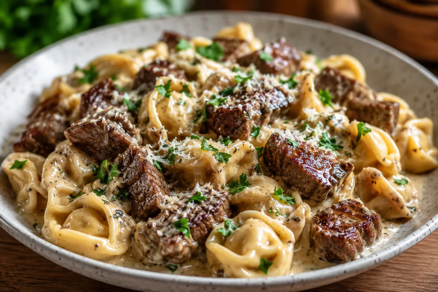 Garlic Steak Tortellini with creamy garlic parmesan sauce and seared steak bites