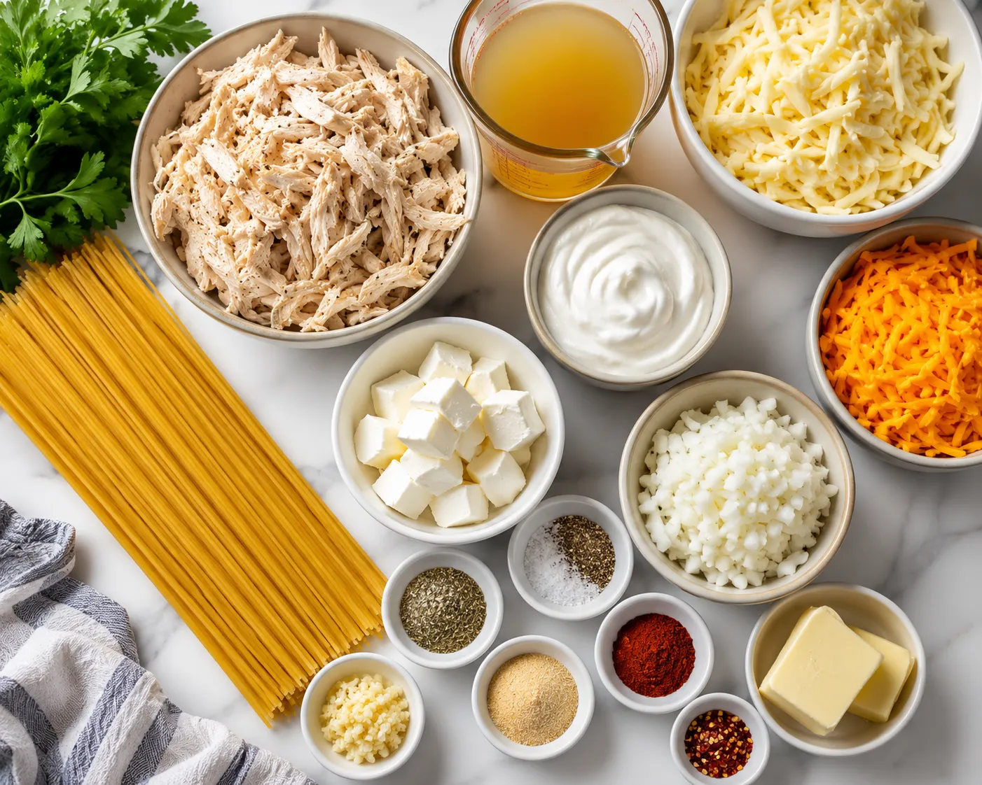 Ingredients for Monterey chicken spaghetti arranged on a kitchen counter
